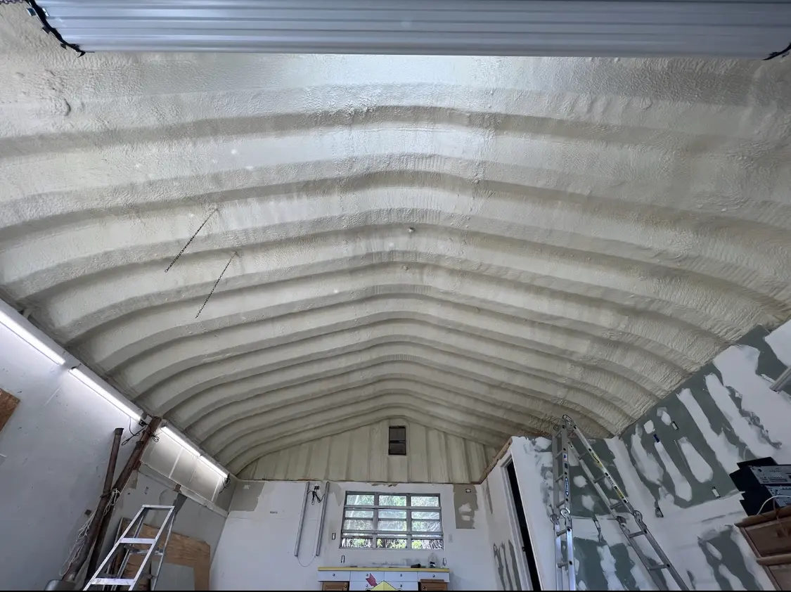 Spray polyurethane foam applied to the underside of a metal roof deck in Sun Village